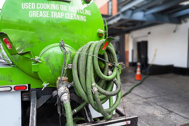 large truck pumping grease trap at a restaurant in Barkhamsted